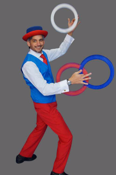 Multi-colour costumed jugglers